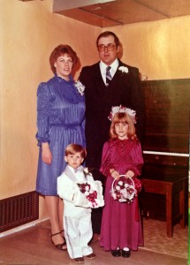 I think my favorite part is my brother's face.  At just under 2, had had no idea why he was in a white tux carrying a pillow.